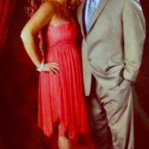 Off the shoulder beaded cocktail dress in coral.